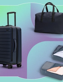 Three pieces of luggage are placed in front of a colorful backdrop.