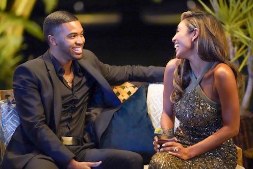 a photo of contestant Ivan sitting with Bachelorette Tayshia