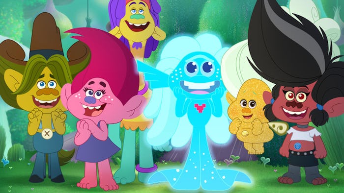 Six colorful cartoon trolls look up in gleeful excitement.