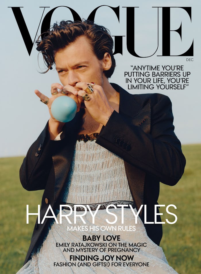The cover of Vogue Magazine featuring Harry Styles wearing a black blazer and blue tulle dress