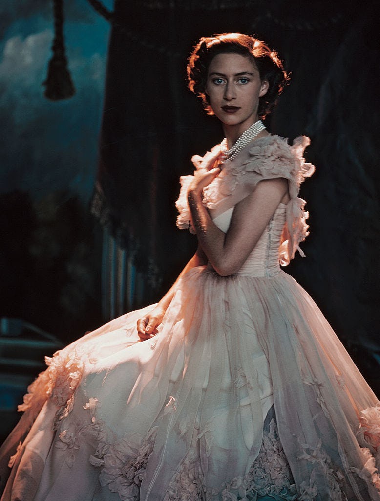 Princess Margaret wearing a pale pink gown with pearls around her neck