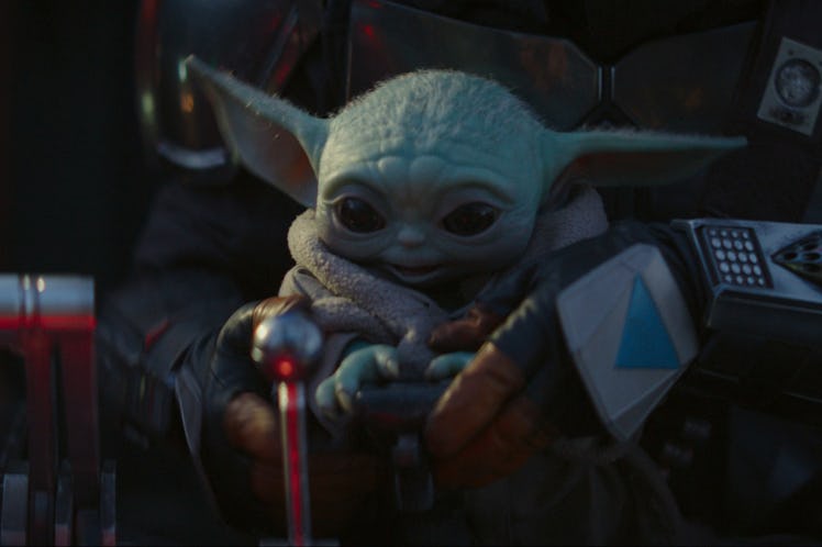 Baby Yoda tries to operate a spaceship on "The Mandalorian."