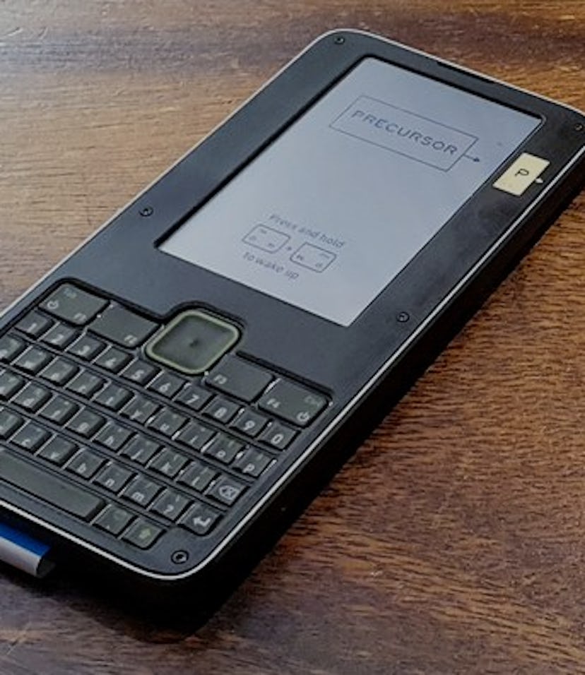 Precursor device on table next to a beer