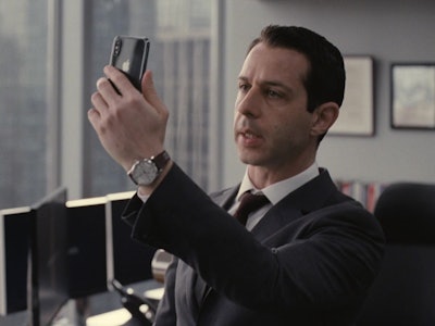 The actor Jeremy Strong playing Kendall Roy in the HBO series succession, on his phone, is a good ex...