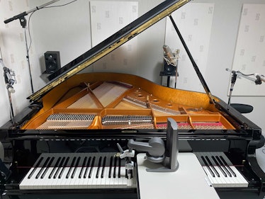 a piano with a haptic feedback tool