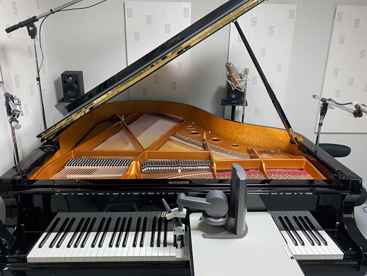 a piano with a haptic feedback tool