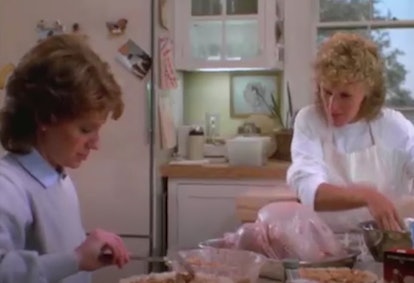 Two women cutting turkey meat in "The Big Chill" movie