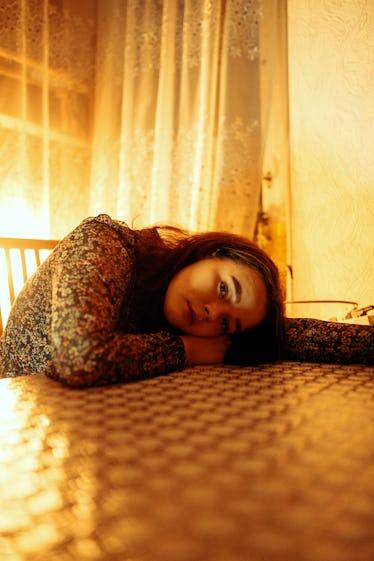 Young woman leaning head on the table
