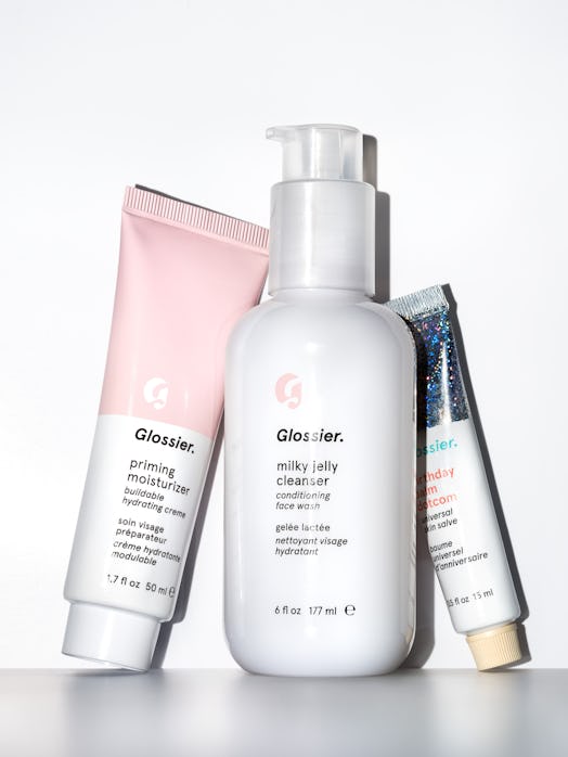 Limited-Edition Glossier Set upright leaning next to each other in front of a white background