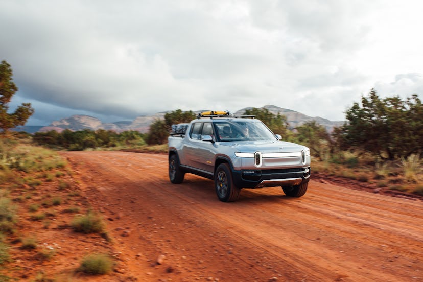 One of Rivian's electric trucks driving off-road.