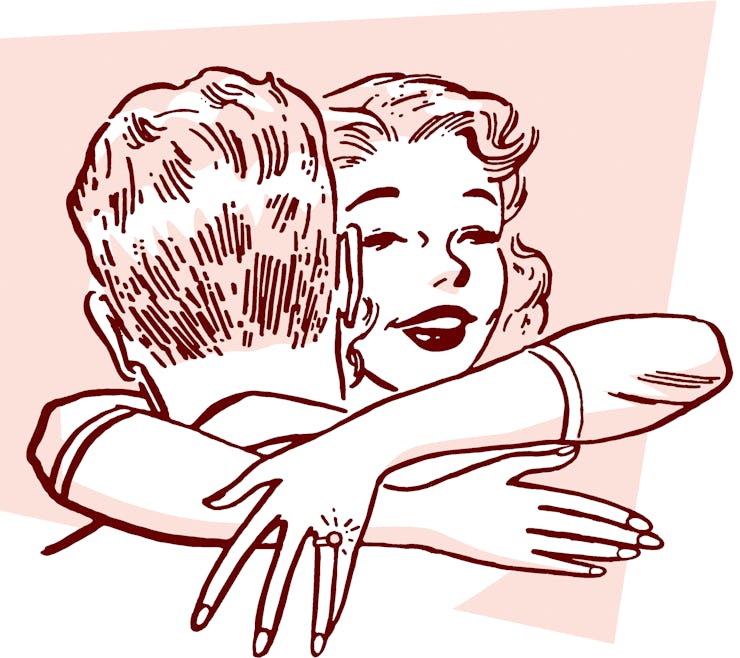 Two people hugging.
