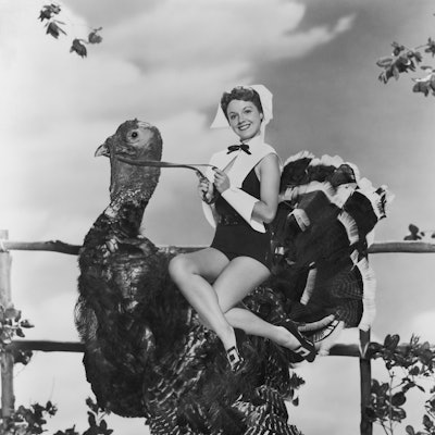 A starlet rides a turkey.