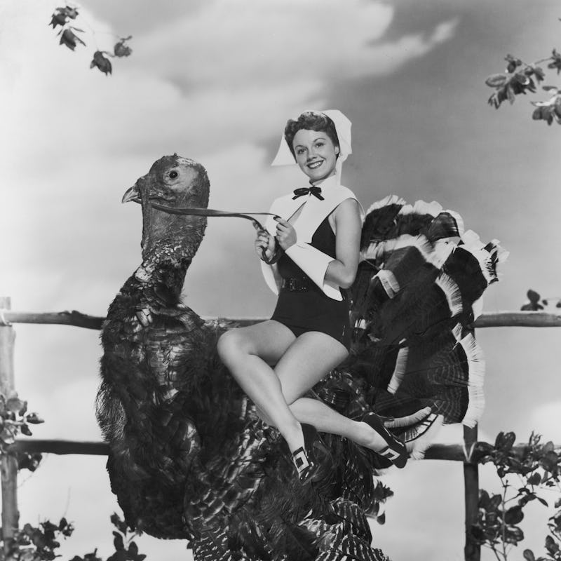 A starlet rides a turkey.