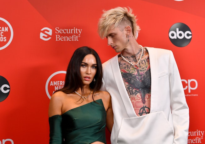 Megan Fox and Machine Gun Kelly pose together on the red carpet at the 2020 AMAs