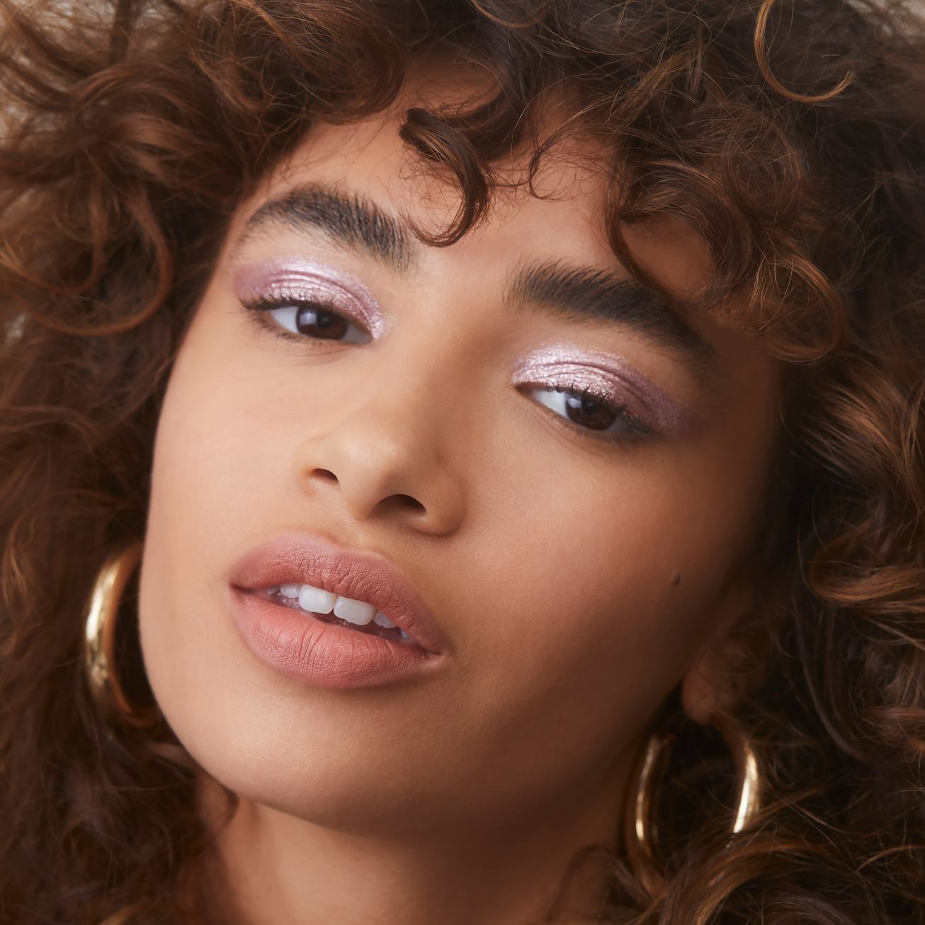 A model wears Liquid Metallic Eyeshadows