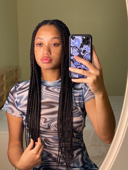Salem Mitchell in a mirror selfie with blue print dress and knotless box braids.