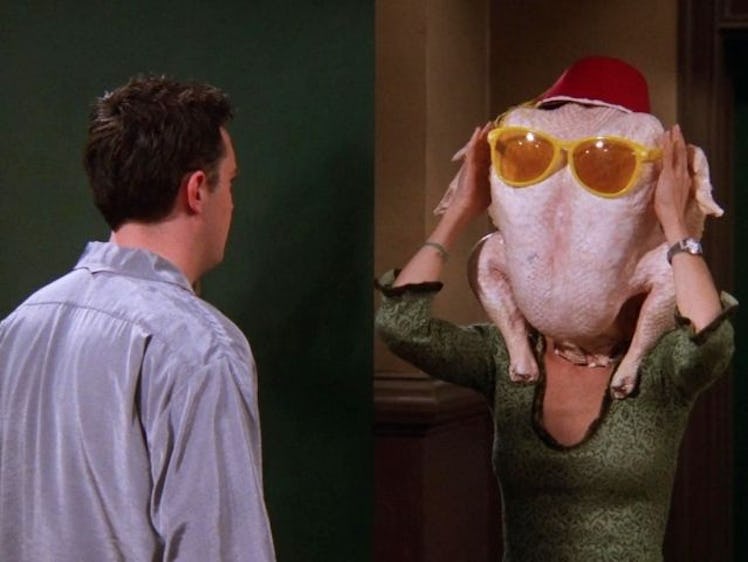 Monica (Courteney Cox) from 'Friends' dances with a turkey on her head in the doorway in front of Ch...