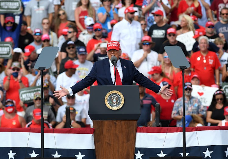 U.S. President Donald Trump addresses supporters at a campaign rally outside Raymond James Stadium