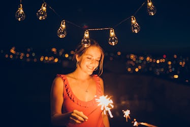 Young woman with sparkler