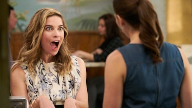 Alexis Rose (Annie Murphy) looks surprised at Twyla (Sarah Levy) while sitting at the counter on 'Sc...