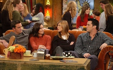 Chandler, Monica, Rachel and Joey from 'Friends' all sit on the couch in Central Perk. 