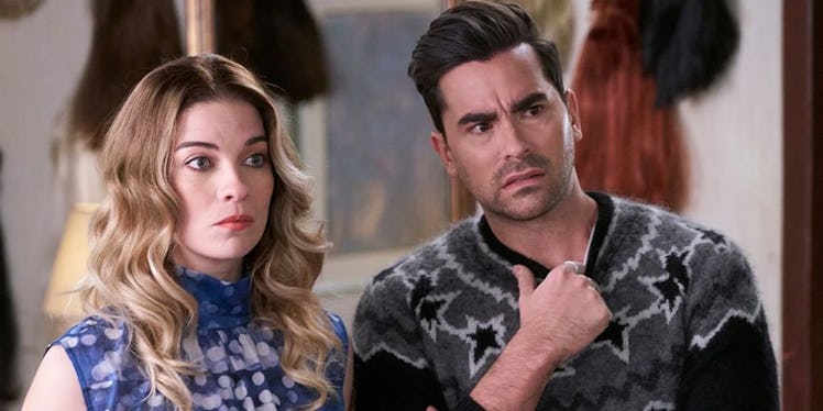 Alexis (Annie Murphy) and David (Dan Levy) look concerned at someone in 'Schitt's Creek.'