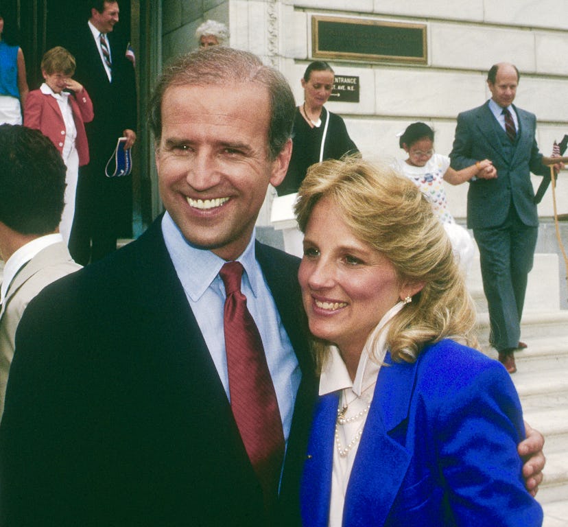 Jill Biden standing next to Joe in a bright blue suit after his first candidacy announcement for a P...