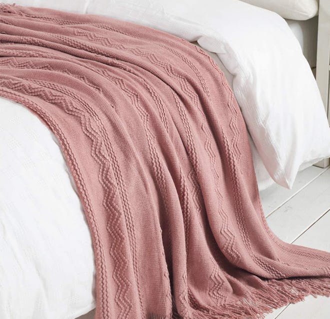 For warm blankets with a decorative flair, consider this textured throw blanket available in a bunch...