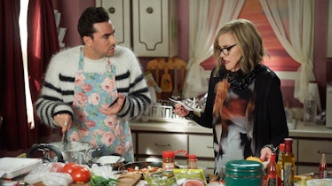 David (Dan Levy) tries to make enchiladas, while his mother, Moira (Catherine O'Hara), goes over the...