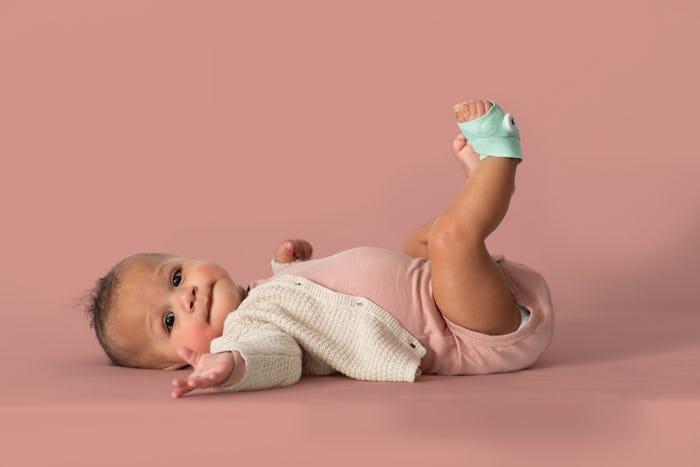 baby girl wearing owlet sock