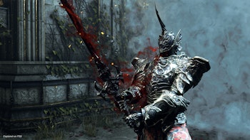 A character in knight armor with blood flying around in Demon's Souls for PS5