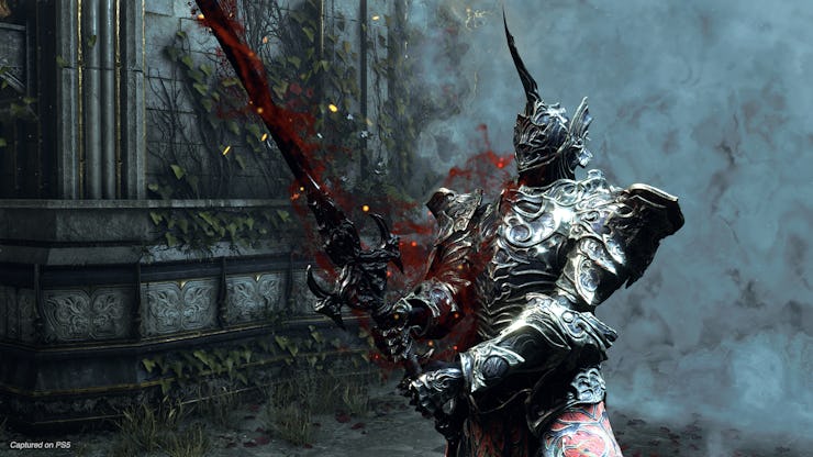 A character in knight armor with blood flying around in Demon's Souls for PS5