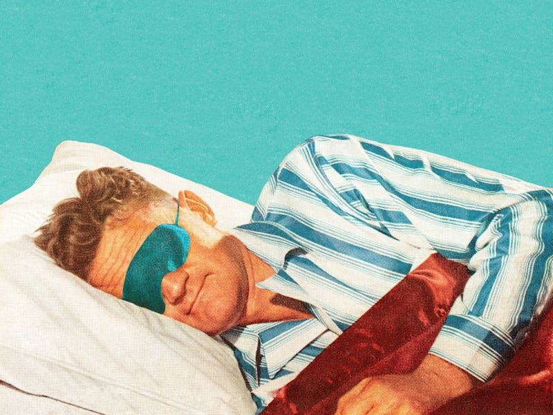 Sleeping man wearing an eye mask.