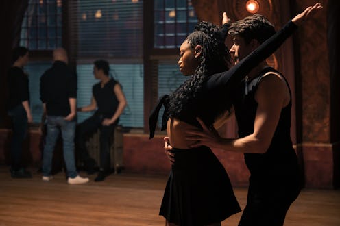 Barton Cowperthwaite as Oren Lennox helps Kylie Jefferson as Neveah Stroyer perfect her dancing form...