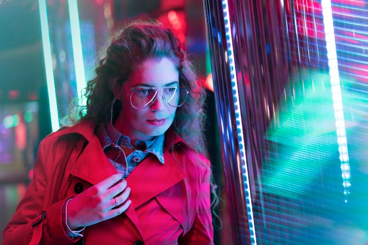 Young woman on vibrant night
