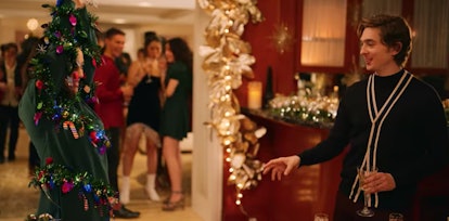 Lily shows off her Christmas tree sweater at a party with Dash in Netflix's 'Dash & Lily.'