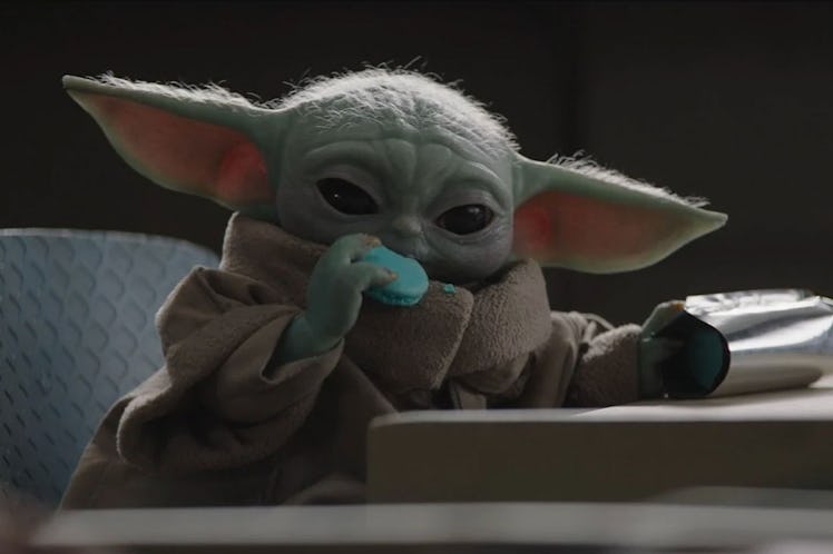 Baby Yoda enjoys a snack in The Mandalorian.