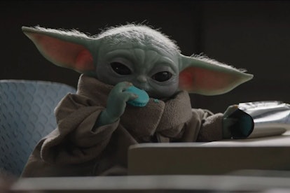 Baby Yoda enjoys a snack in The Mandalorian.