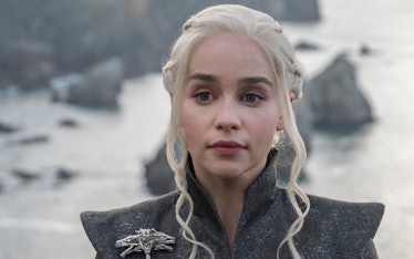 Daenerys Targaryen in a grey cape with a brooch