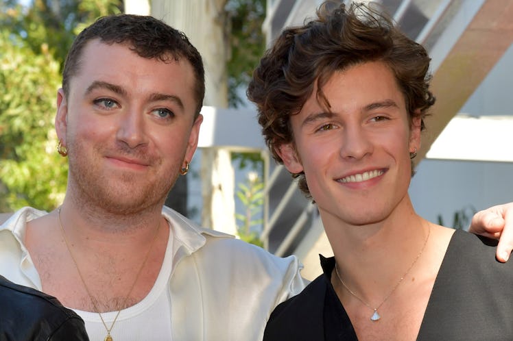 Sam Smith and Shawn Mendes pose together at an event.