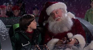 Scott Calvin (Tim Allen) takes on the role of Santa Claus with his son Charlie by his side in the sl...