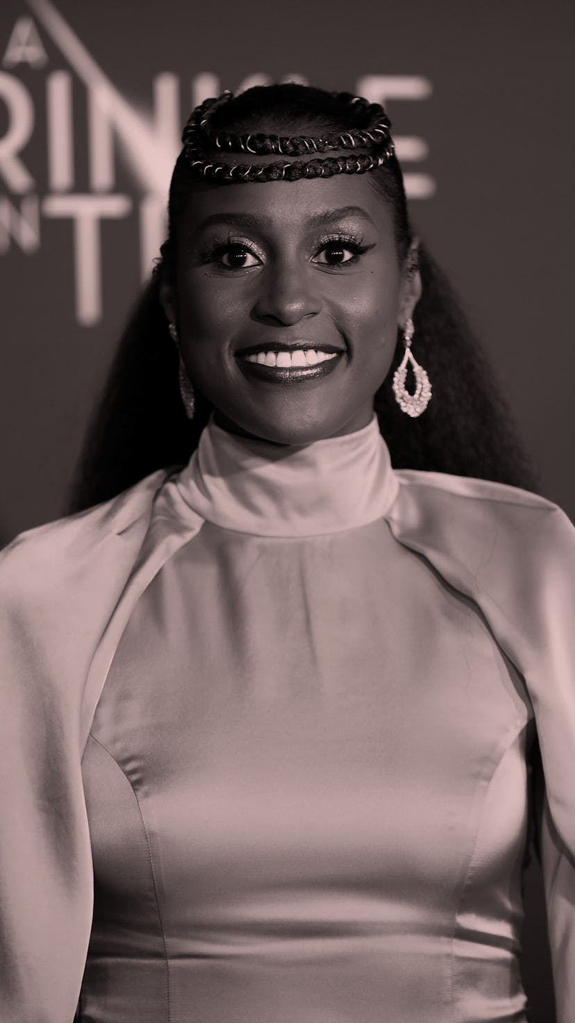 Issa Rae wears a yellow dress at the premiere red carpet for A Wrinkle In Time