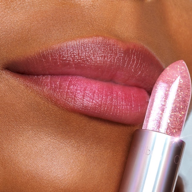 Lips colored pink via the Charlotte Tilbury Glowgasm Lipstick