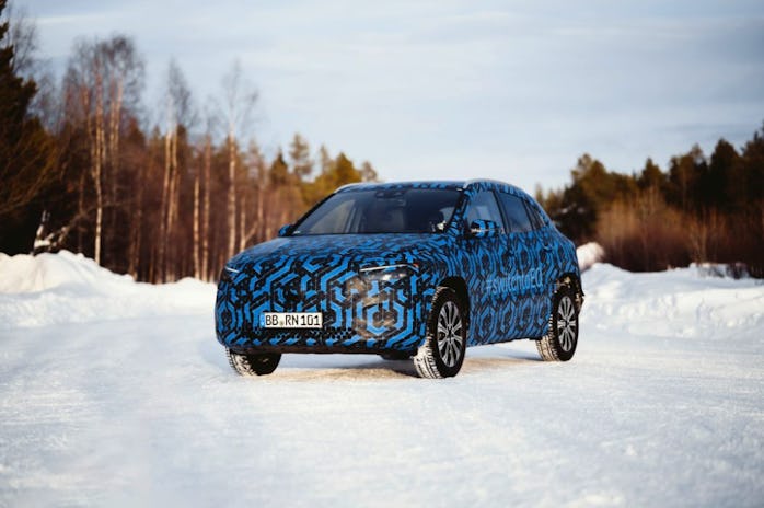 Prototype of the Mercedes-Benz EQA electric SUV in a wintery terrain.