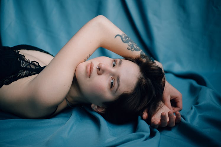 Woman Laying On Blue Cloth
