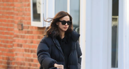 Irina Shayk wore white combat boots with her puffer coat, a new take on her winter uniform