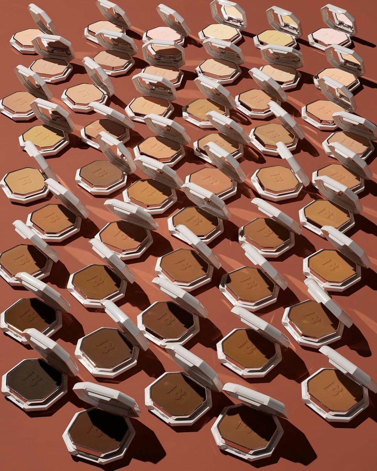 A shot of all 50 Fenty Beauty powder foundations