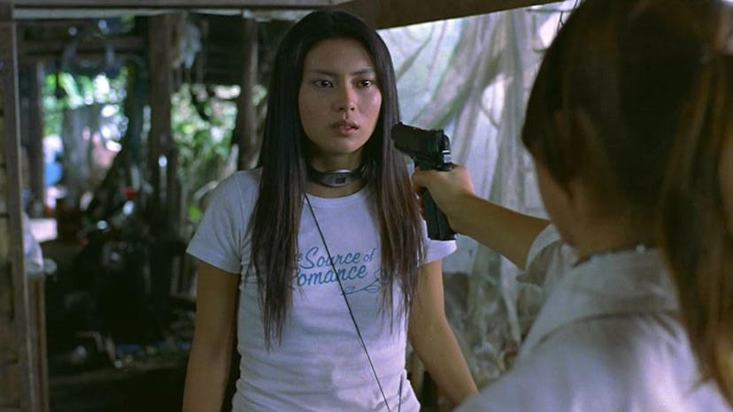 A member of the cast aiming at the other actress with a gun 