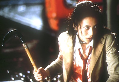 Chiaki Kuriyama trying to defend herself with a weapon