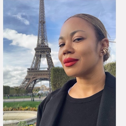 CHANEL Makeup Artist Tasha Reiko Brown posing in front of the eiffel tower